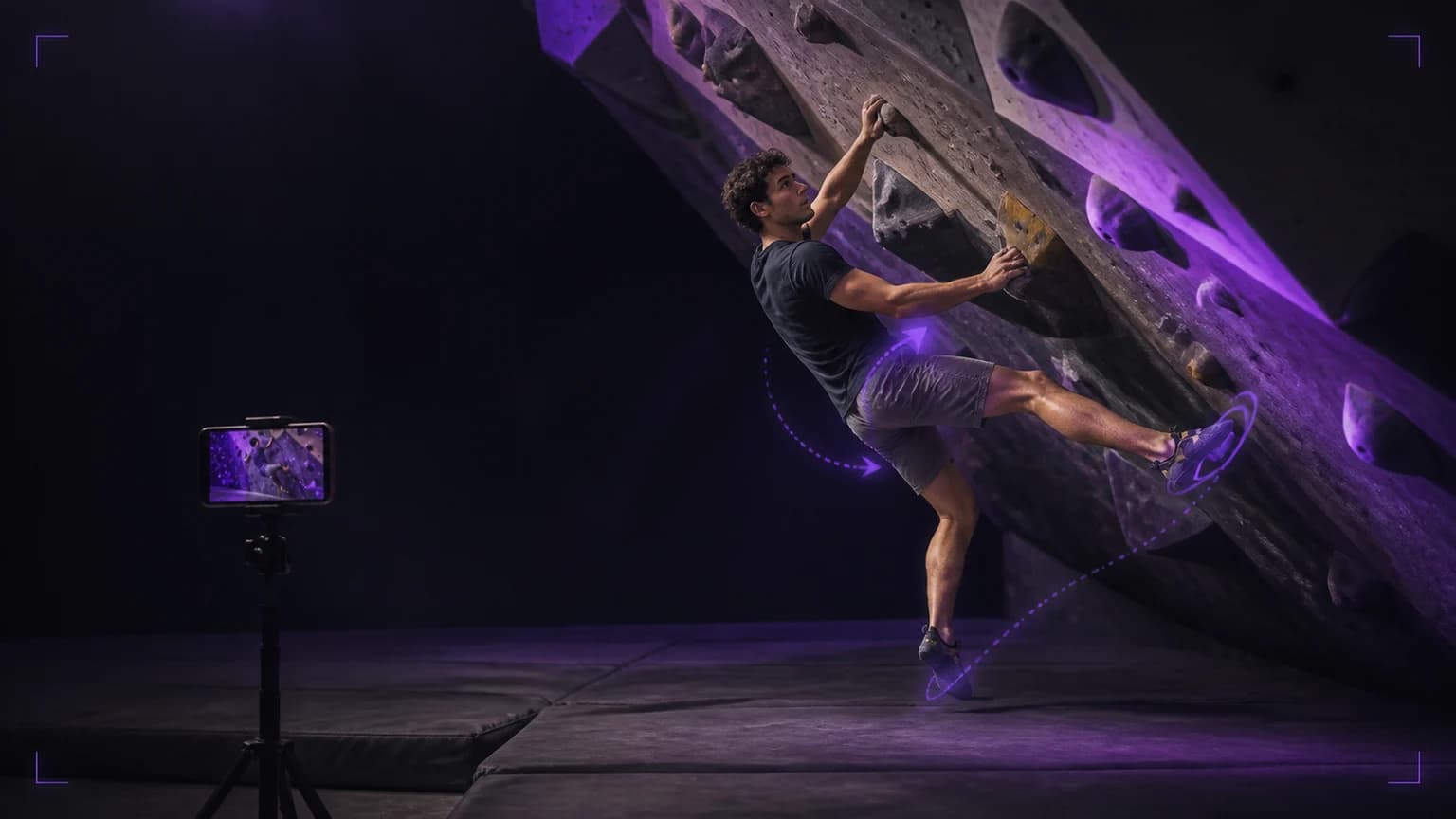 Boulderer filming a controlled indoor attempt from the side with violet light and a movement-review interface